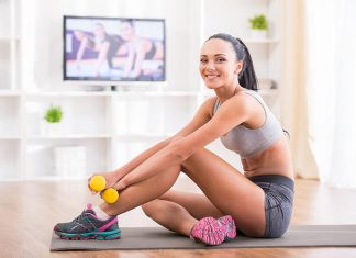 Fit woman does home workouts