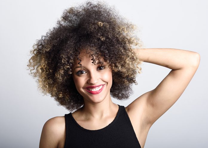 Beautiful smiling woman with curly hair