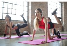 Benefits of Attending Regular Pilates Classes Women exercising in a pilates class