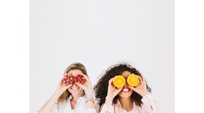 Help Yourself to a Healthy Diet for Stress Relief Two happy women having fruits for stress relief