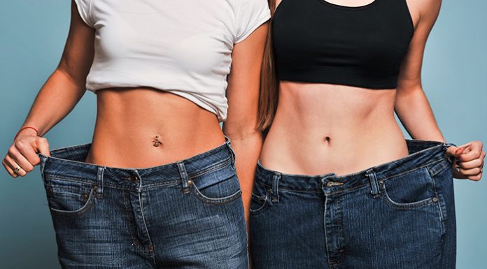 Two fit women in loose jeans