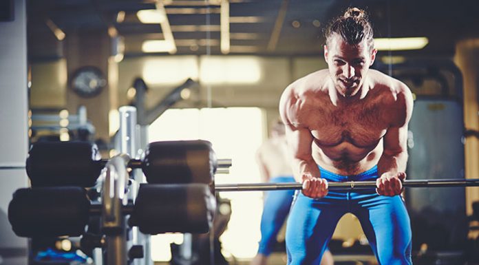 Fit sportsman lifting weight